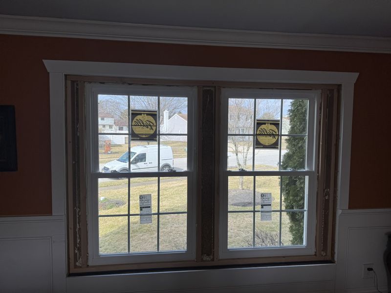 New double window installed from inside, framed and awaiting casing